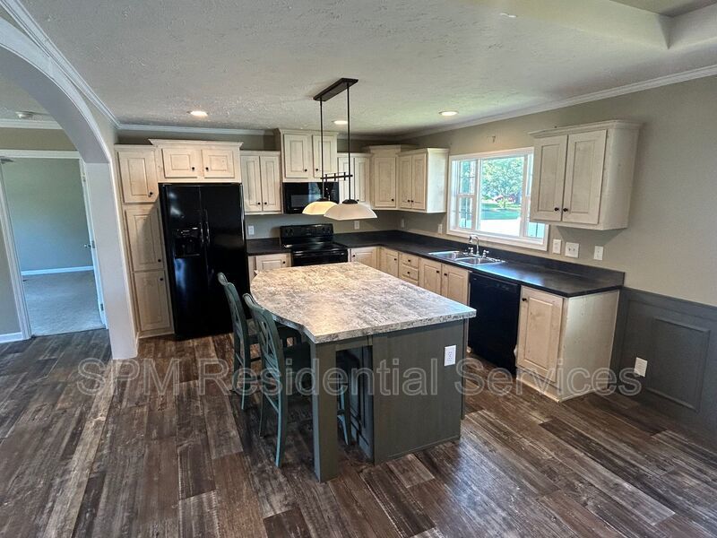 Large fenced backyard, Community Pool, and Kitchen Island property image