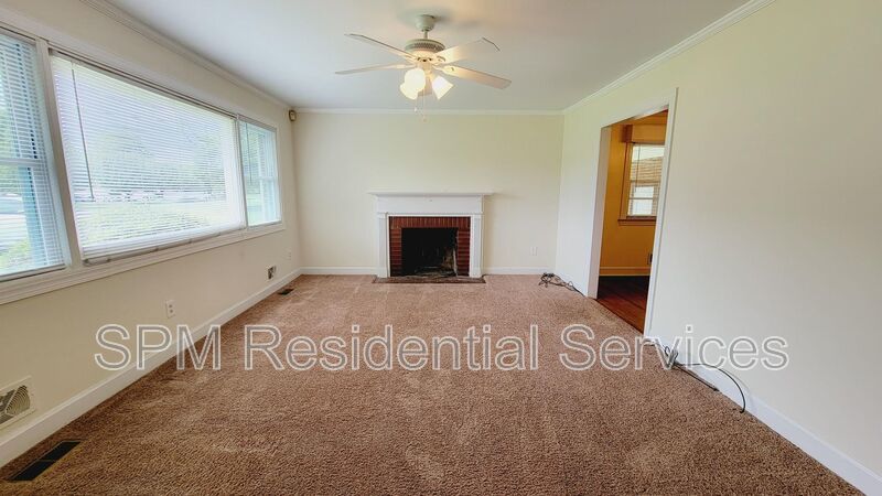 3 bedroom 1.5 bath brick ranch with storage building on .4 acres property image