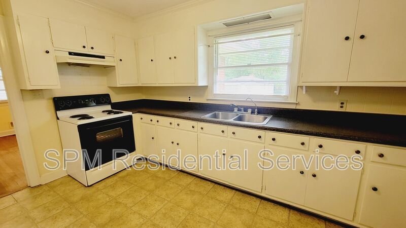 3 bedroom 1.5 bath brick ranch with storage building on .4 acres property image