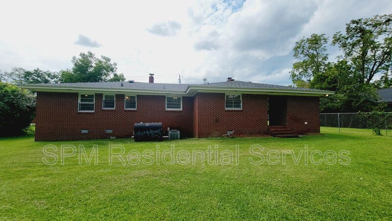 3 bedroom 1.5 bath brick ranch with storage building on .4 acres property image