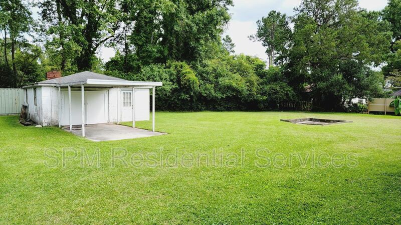 3 bedroom 1.5 bath brick ranch with storage building on .4 acres property image