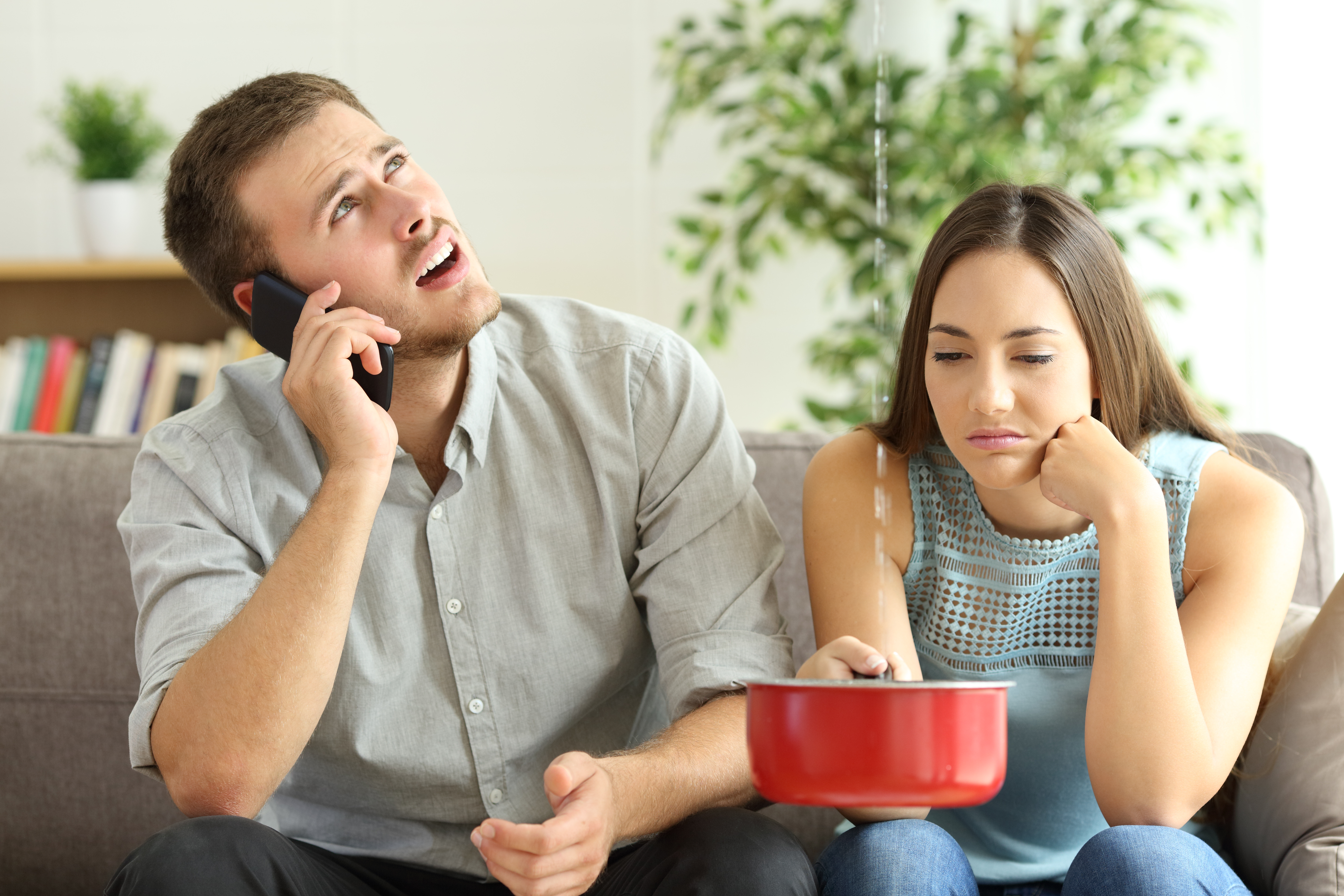 couple experiencing leak at rental property